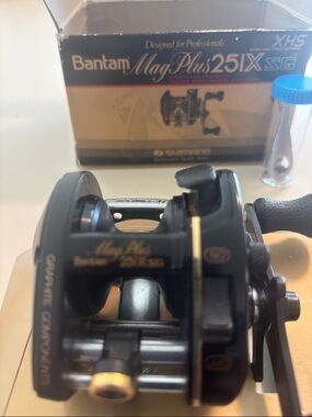 Shimano black and gold low-profile left hand baitcasting reel